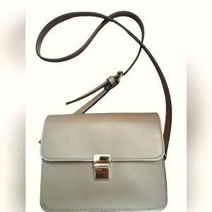 Taupe color small saddle  bag